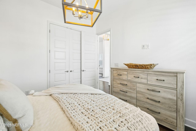 97 Marquesa Cir, Saint Johns, FL 32259 - bedroom with a chandelier, a closet, and dark wood-style floors