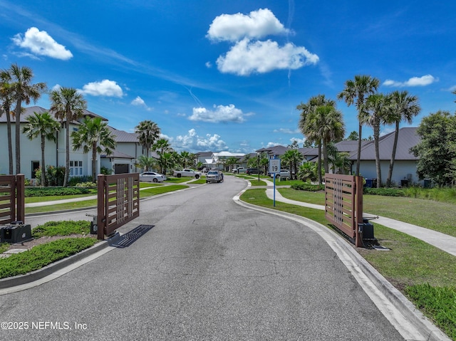 97 Marquesa Cir, Saint Johns, FL 32259 - view of asphalt road with a residential view, sidewalks, curbs, and traffic signs