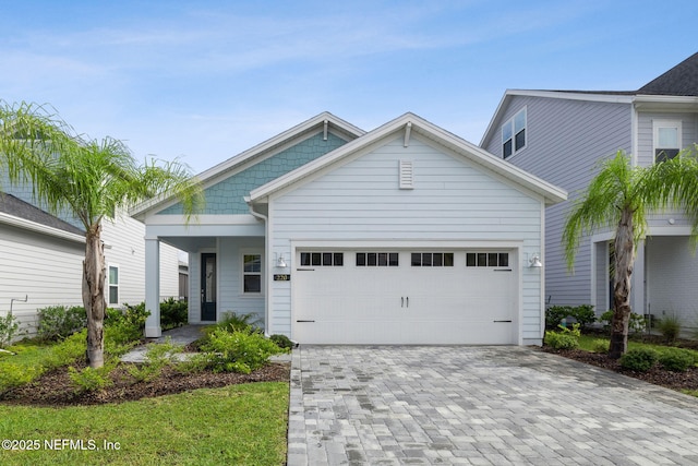 220 Killarney Ave, Saint Johns, FL 32259 - view of front of home with a garage and decorative driveway
