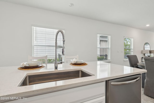 220 Killarney Ave, Saint Johns, FL 32259 - kitchen featuring dishwasher, light stone countertops, white cabinets, recessed lighting, and open floor plan