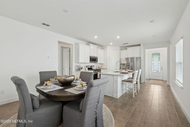 220 Killarney Ave, Saint Johns, FL 32259 - dining area with light wood-style floors and recessed lighting