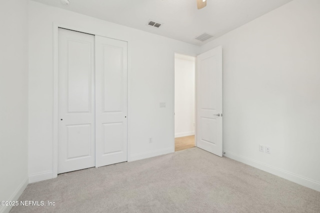 220 Killarney Ave, Saint Johns, FL 32259 - unfurnished bedroom with carpet flooring, a closet, and a ceiling fan