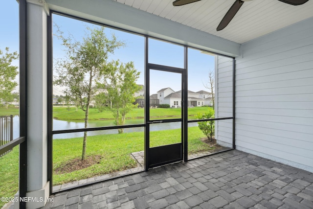 220 Killarney Ave, Saint Johns, FL 32259 - unfurnished sunroom featuring a water view, ceiling fan, and a residential view