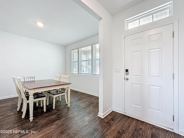 65274 Forest Glen Ln, Yulee, FL 32097 - dining room with healthy amount of natural light, dark wood finished floors, and baseboards