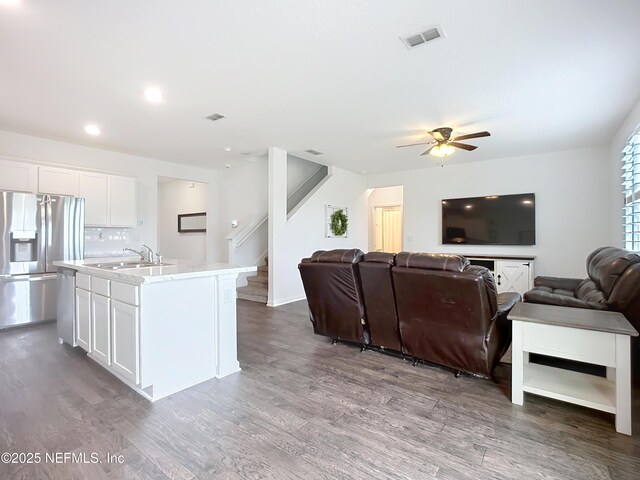 65274 Forest Glen Ln, Yulee, FL 32097 - living room with ceiling fan, wood finished floors, stairway, and recessed lighting