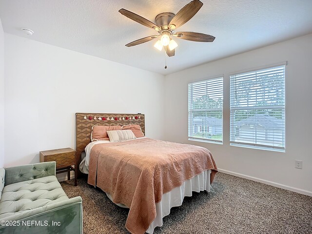 65274 Forest Glen Ln, Yulee, FL 32097 - bedroom featuring baseboards, dark colored carpet, and ceiling fan
