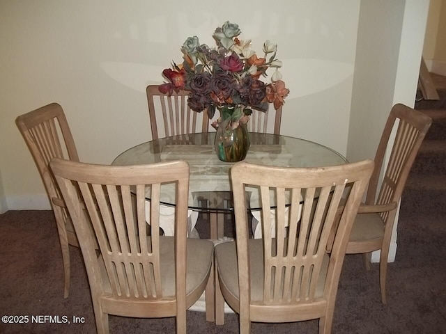 1050 Alderside St, Jacksonville, FL 32208 - carpeted dining space with baseboards
