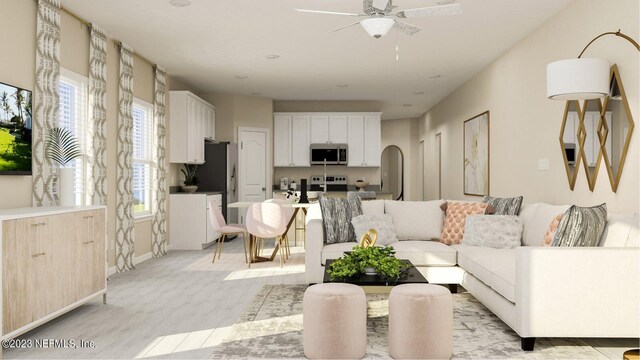 100 Round Robin Run, Saint Johns, FL 32259 - living room featuring healthy amount of natural light, a ceiling fan, light wood-style flooring, and arched walkways