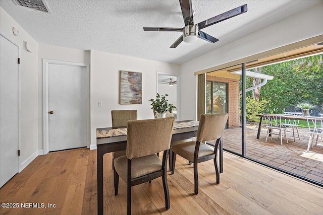 100 Palmera Ct, Ponte Vedra Beach, FL 32082 - dining room with ceiling fan, a textured ceiling, and light wood-type flooring