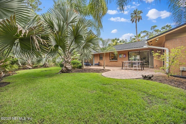 100 Palmera Ct, Ponte Vedra Beach, FL 32082 - view of grassy yard with a patio area