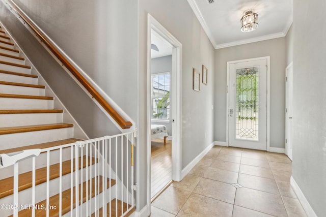96266 Dowling Dr, Yulee, FL 32097 - tiled foyer with ornamental molding, baseboards, and stairway