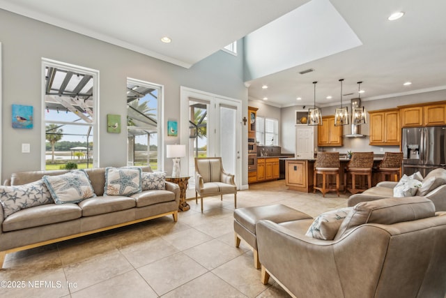 96266 Dowling Dr, Yulee, FL 32097 - living room featuring light tile patterned floors, recessed lighting, ornamental molding, and a chandelier