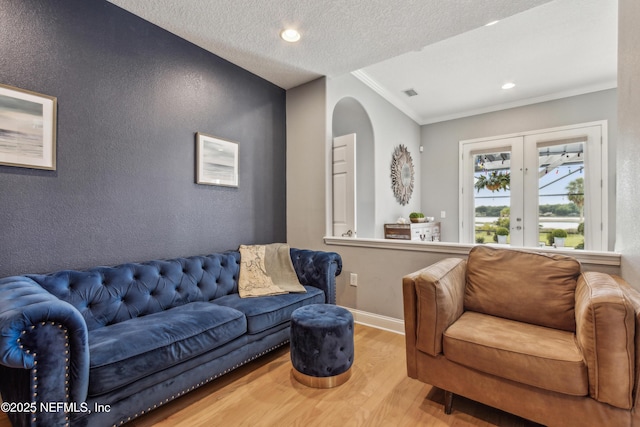 96266 Dowling Dr, Yulee, FL 32097 - living area with wood finished floors, crown molding, arched walkways, baseboards, and recessed lighting