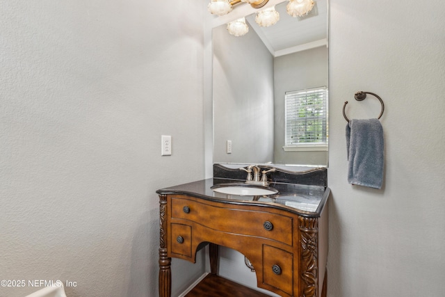 96266 Dowling Dr, Yulee, FL 32097 - bathroom featuring vanity, crown molding, and a chandelier