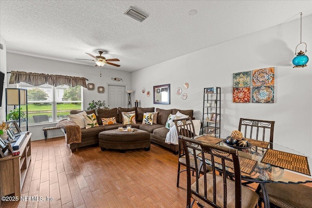 724 Middle Branch Way, Fruit Cove, FL 32259 - living room with ceiling fan, wood finished floors, and a textured ceiling