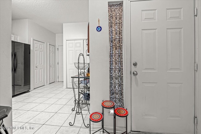 724 Middle Branch Way, Fruit Cove, FL 32259 - entrance foyer featuring a textured ceiling and light tile patterned floors