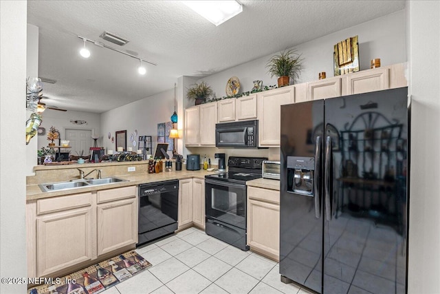 724 Middle Branch Way, Fruit Cove, FL 32259 - kitchen with black appliances, a sink, light countertops, light tile patterned floors, and a textured ceiling