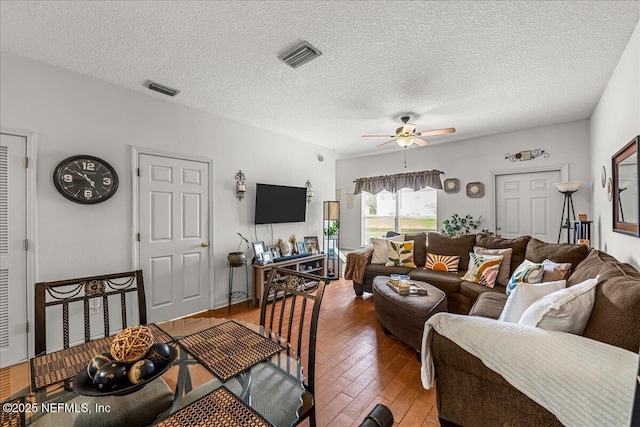 724 Middle Branch Way, Fruit Cove, FL 32259 - living room with a ceiling fan, hardwood / wood-style floors, and a textured ceiling