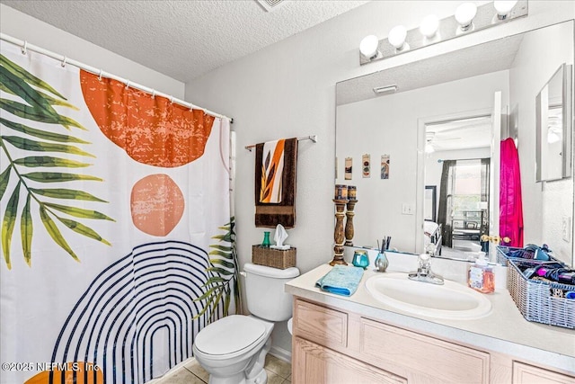 724 Middle Branch Way, Fruit Cove, FL 32259 - full bath with vanity, toilet, a shower with curtain, tile patterned flooring, and a textured ceiling