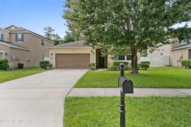 4916 Creek Bluff Ln, Middleburg, FL 32068 - view of front of home featuring an attached garage, driveway, and stucco siding