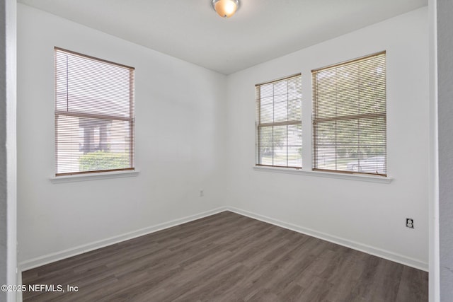 4916 Creek Bluff Ln, Middleburg, FL 32068 - spare room with dark wood-type flooring and baseboards