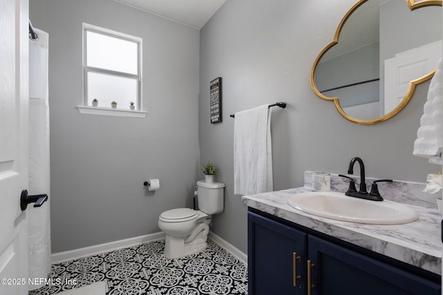 4916 Creek Bluff Ln, Middleburg, FL 32068 - full bath with vanity, baseboards, toilet, and tile patterned flooring
