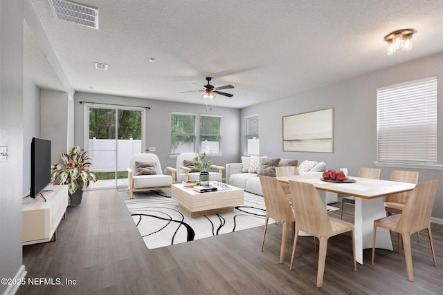 4916 Creek Bluff Ln, Middleburg, FL 32068 - dining area featuring dark wood finished floors, a ceiling fan, and a textured ceiling