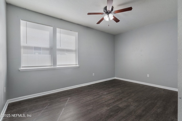 4916 Creek Bluff Ln, Middleburg, FL 32068 - empty room with dark wood-style flooring, ceiling fan, and baseboards