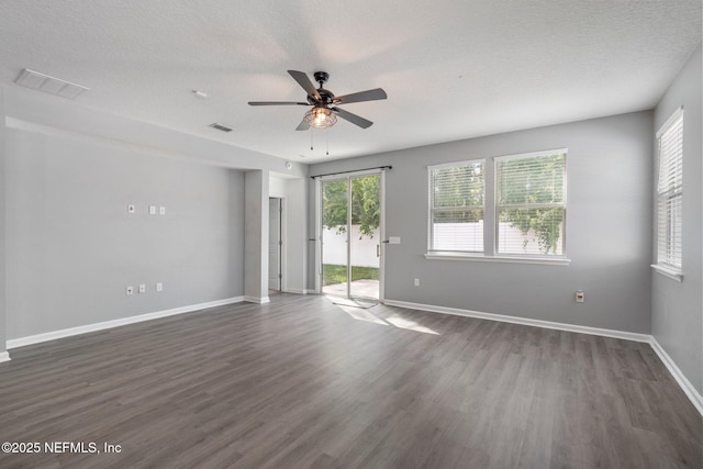4916 Creek Bluff Ln, Middleburg, FL 32068 - spare room with ceiling fan, dark wood finished floors, baseboards, and a textured ceiling