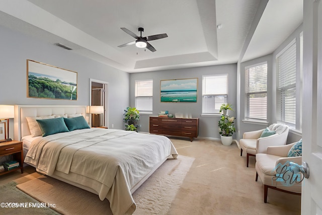4916 Creek Bluff Ln, Middleburg, FL 32068 - bedroom with a tray ceiling, baseboards, light carpet, and ceiling fan