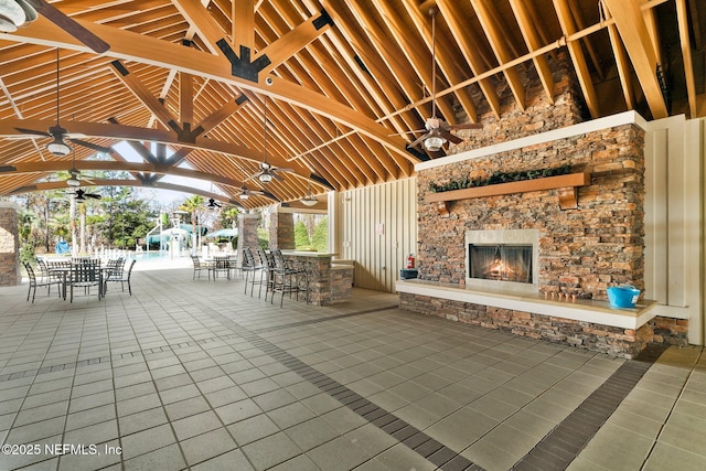 4916 Creek Bluff Ln, Middleburg, FL 32068 - view of patio with a ceiling fan, outdoor dining area, an outdoor stone fireplace, and a gazebo