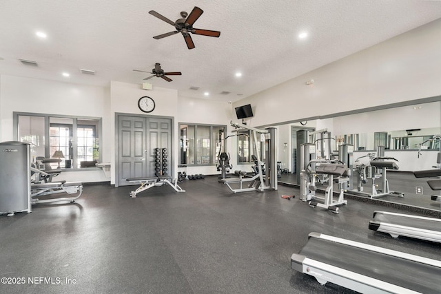 4916 Creek Bluff Ln, Middleburg, FL 32068 - exercise room featuring a textured ceiling, a ceiling fan, recessed lighting, and a towering ceiling
