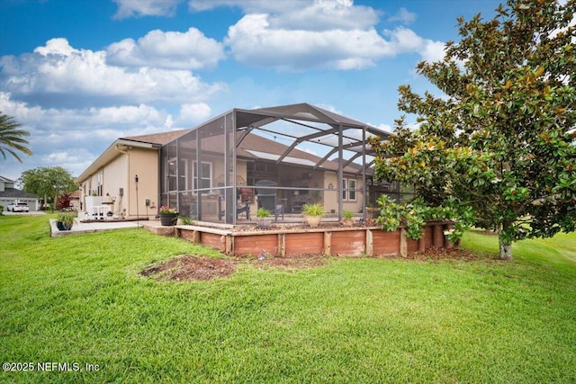 1714 Chatham Village Dr, Fleming Island, FL 32003 - back of house with a patio area, a lawn, glass enclosure, and stucco siding