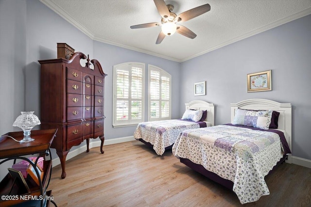 1714 Chatham Village Dr, Fleming Island, FL 32003 - bedroom featuring light wood finished floors, a textured ceiling, ornamental molding, and ceiling fan