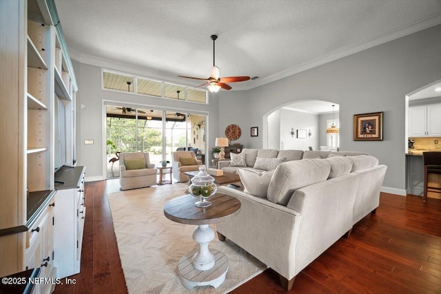 1714 Chatham Village Dr, Fleming Island, FL 32003 - living area featuring arched walkways, crown molding, dark wood-type flooring, and ceiling fan
