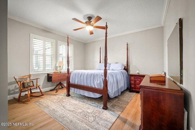 1714 Chatham Village Dr, Fleming Island, FL 32003 - bedroom with wood finished floors, crown molding, a textured ceiling, and a ceiling fan