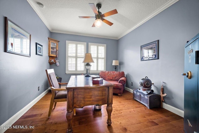 1714 Chatham Village Dr, Fleming Island, FL 32003 - home office featuring a textured ceiling, ceiling fan, wood finished floors, and ornamental molding