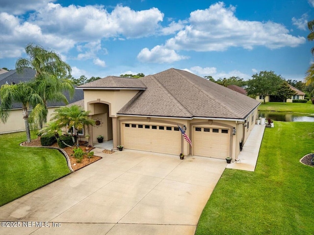 1714 Chatham Village Dr, Fleming Island, FL 32003 - view of front facade featuring a garage, stucco siding, concrete driveway, and a front yard