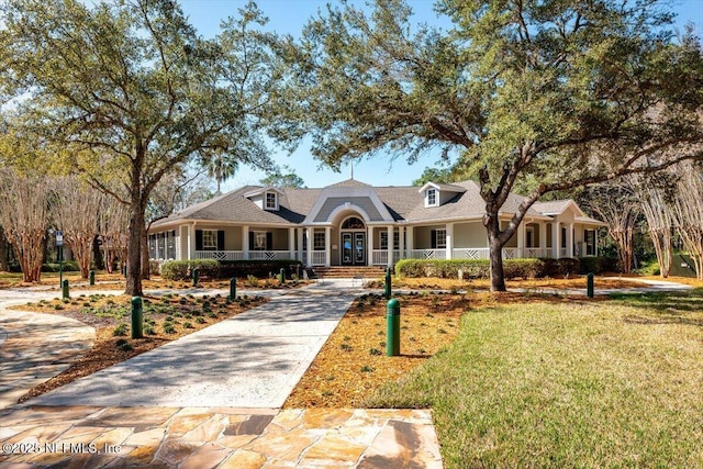 1714 Chatham Village Dr, Fleming Island, FL 32003 - view of front of property featuring a porch and a front lawn