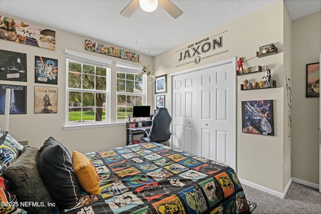 3172 Treeside Ln, Green Cove Springs, FL 32043 - carpeted bedroom with a closet, baseboards, a textured ceiling, and ceiling fan