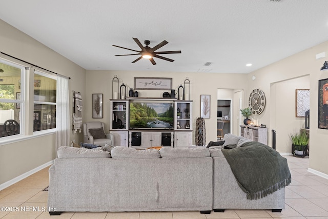 3172 Treeside Ln, Green Cove Springs, FL 32043 - living room with light tile patterned floors, baseboards, ceiling fan, and recessed lighting