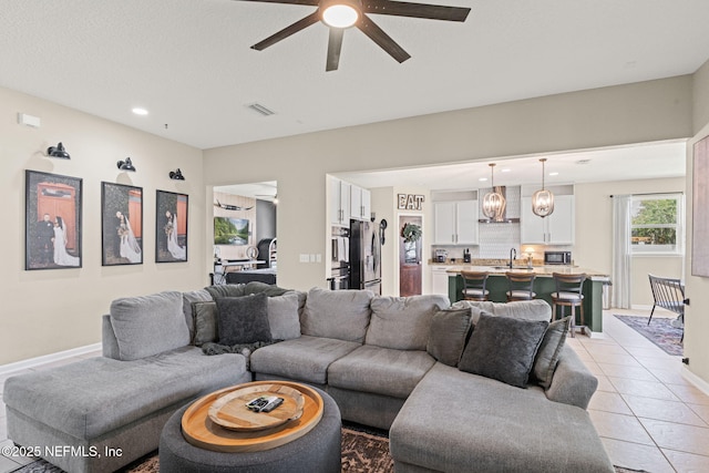 3172 Treeside Ln, Green Cove Springs, FL 32043 - living room with ceiling fan, recessed lighting, light tile patterned flooring, and baseboards