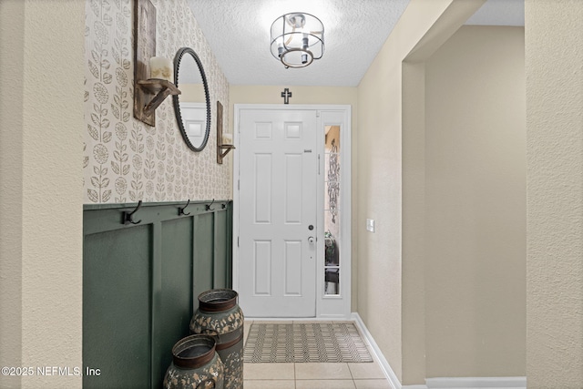 3172 Treeside Ln, Green Cove Springs, FL 32043 - doorway to outside with tile patterned flooring, a textured ceiling, and baseboards