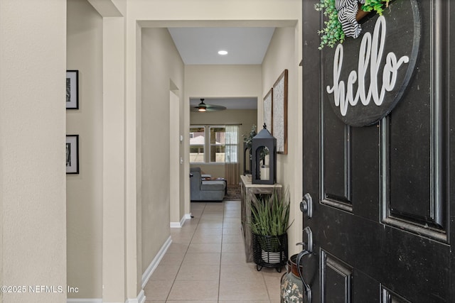 3172 Treeside Ln, Green Cove Springs, FL 32043 - entryway with light tile patterned floors, baseboards, and a ceiling fan