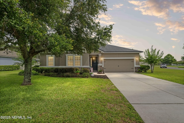 3172 Treeside Ln, Green Cove Springs, FL 32043 - view of property hidden behind natural elements featuring stucco siding, concrete driveway, a garage, and a front yard