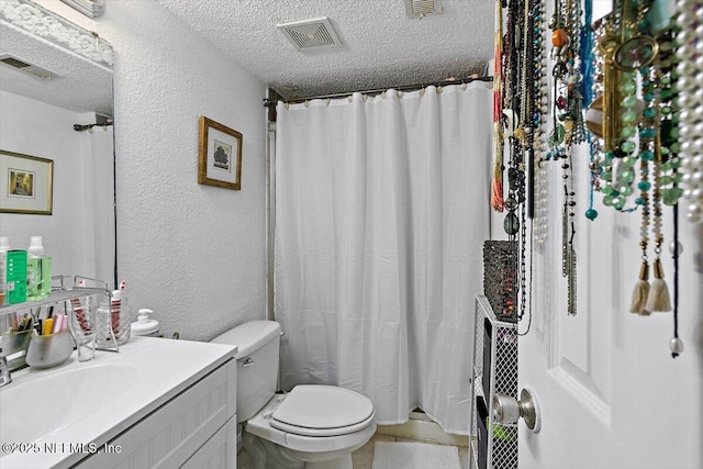 6655 Bell Tower Ct Unit 1, Jacksonville, FL 32217 - bathroom featuring a textured ceiling, a textured wall, vanity, tile patterned flooring, and a shower with curtain