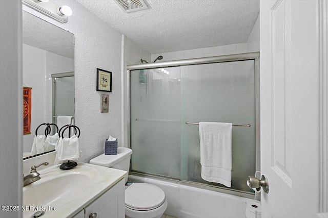 6655 Bell Tower Ct Unit 1, Jacksonville, FL 32217 - full bath with a textured ceiling, a textured wall, vanity, and bath / shower combo with glass door
