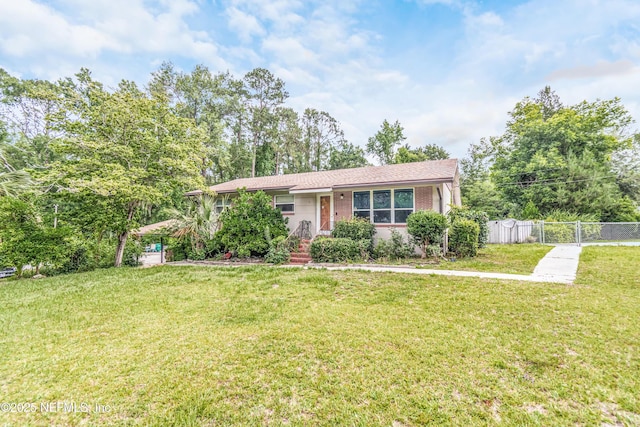 1165 5th St, Macclenny, FL 32063 - view of front facade featuring brick siding and a gate