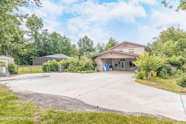 1165 5th St, Macclenny, FL 32063 - view of front facade with driveway and a carport