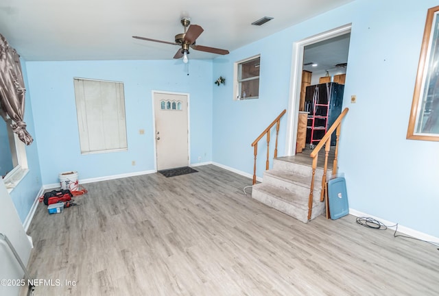 1165 5th St, Macclenny, FL 32063 - foyer featuring wood finished floors, stairway, ceiling fan, and baseboards